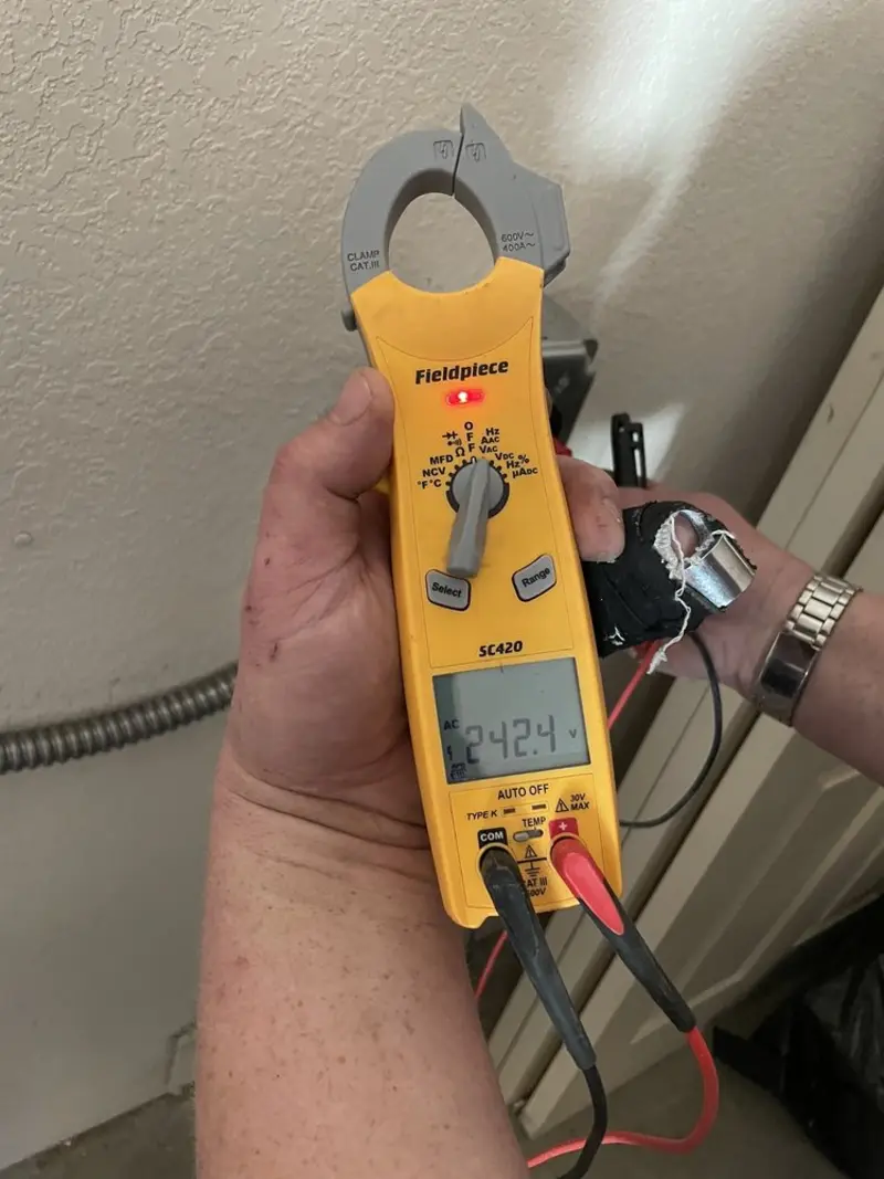 Voltage testing with clamp meter during Generator Installation in Garnett